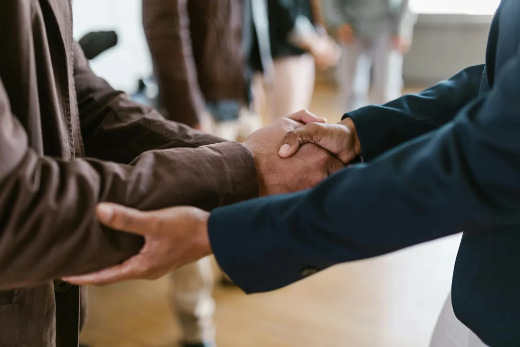 Two professionals shaking hands, symbolizing trust and partnership in financial planning